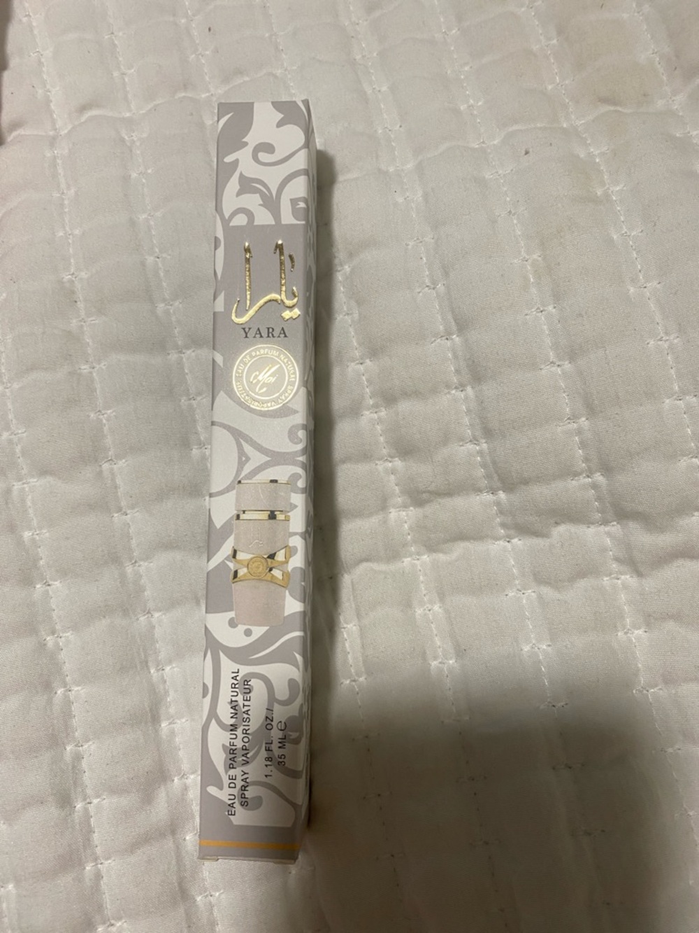 Yara Rollerball Perfume in White & Gold Packaging